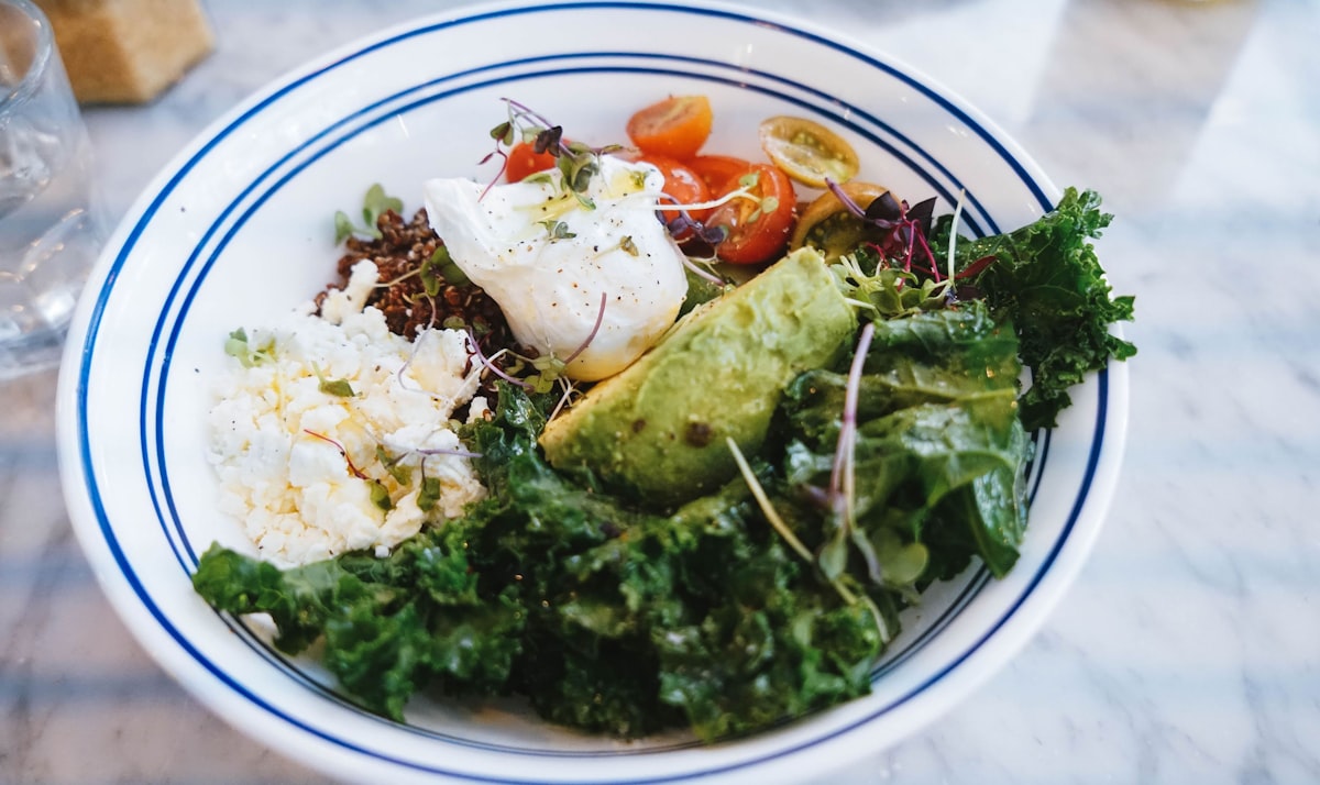 Quinoa breakfast bowl with nuts, seeds, and fresh fruit